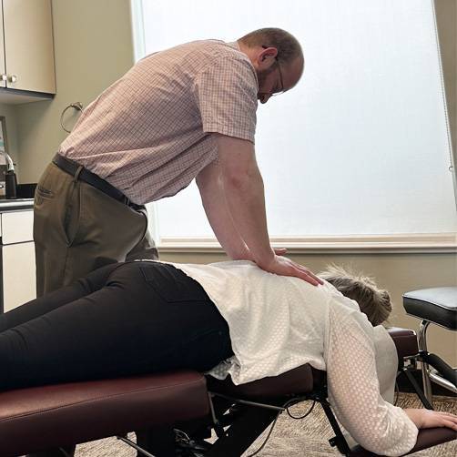 Chiropractor Smithfield UT Ira Crawford Treating Patient Chiropractor Smithfield UT Ira Crawford Treating Patient