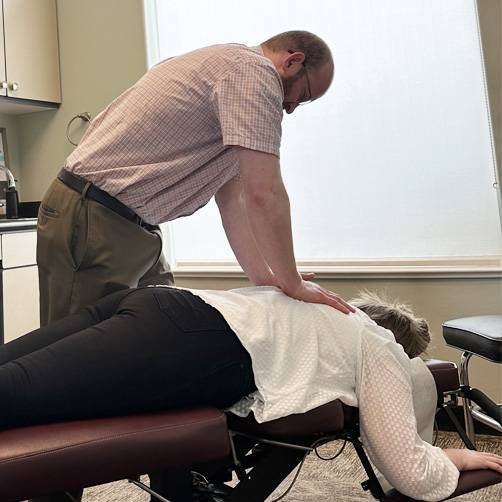 Chiropractor Smithfield UT Ira Crawford Treating Patient